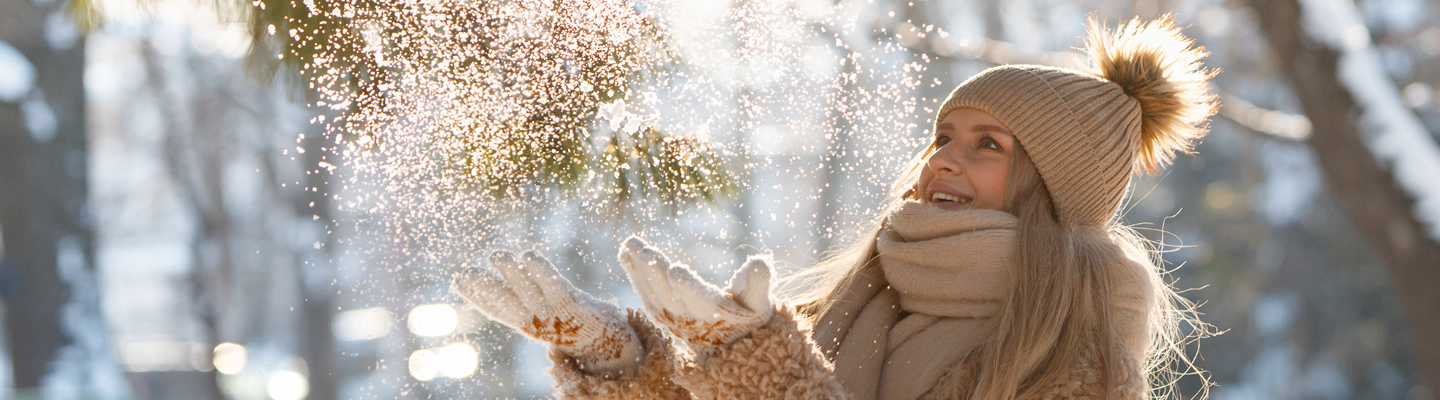 FECA - Checking Savings - Club Accounts happy-female-plays-with-snow-in-sunny-winter-day