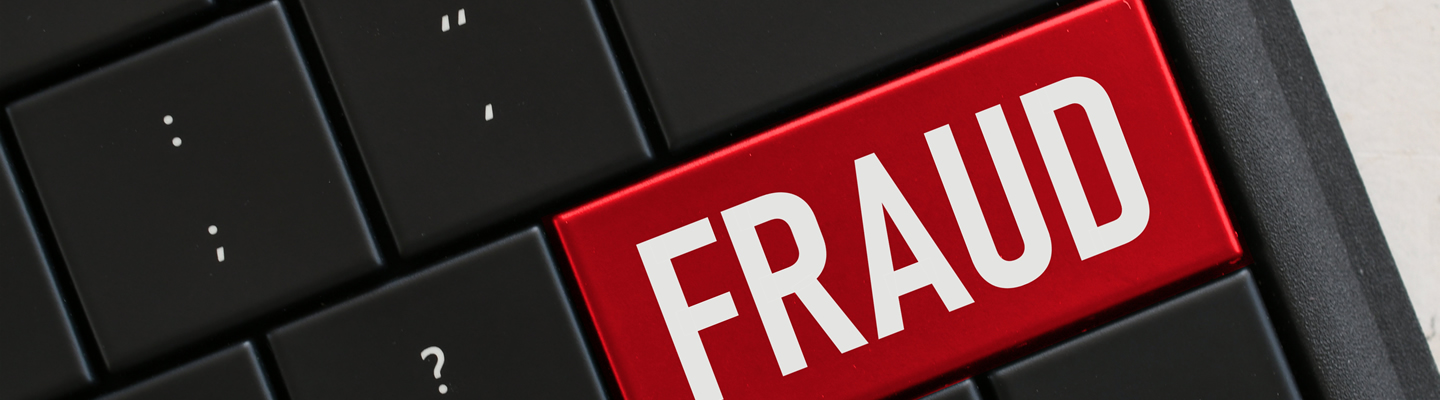 FECA - Report Fraud concept-computer-keyboard-with-red-key-that-says