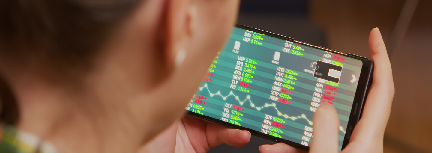 FECA - Invest - Wealth Port back-view-of-woman-checking-stock-trading