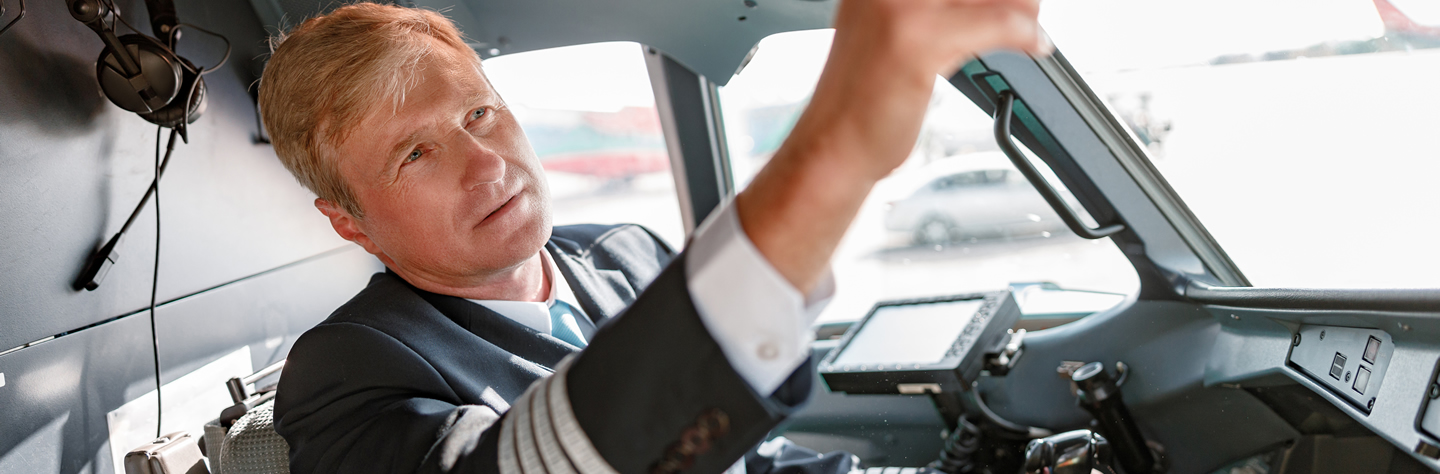 FECA - Loans - Airplane aircraft-pilot-checking-overhead-panel-before