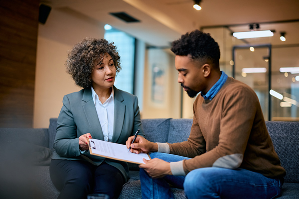 LEARN-Credit Conseling - happy-financial-advisor-having-a-meeting-with-her-600 b