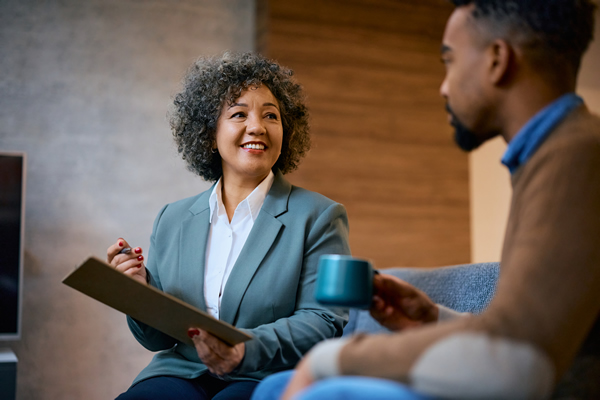 LEARN-Credit Conseling - happy-financial-advisor-having-a-meeting-with-her-600